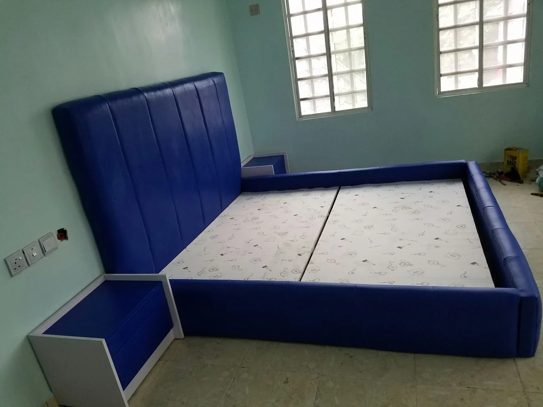 Upholstered blue bed and coordinated nightstand