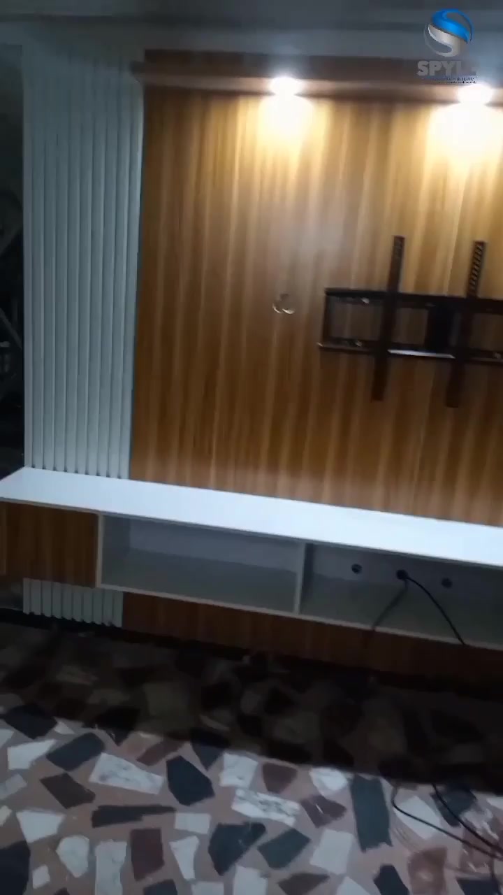 Mirror-effect TV wall with floating media console